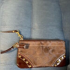 Coach Brown and Gold Clutch with Sophisticated Design